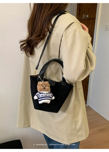 Retro black faux suede bucket bag with a cute bear charm and adjustable shoulder strap