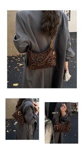 Detail of leopard print crescent bag with leather tassel and adjustable shoulder strap