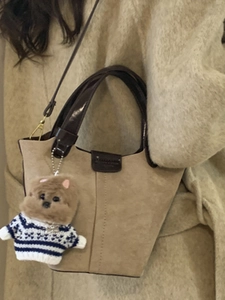 Retro frosted suede bucket bag in deep brown with a cute puppy plush charm pendant