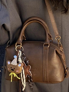 Retro dark brown Boston handbag for women with cute plush bear charm and crossbody strap