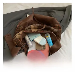 Spacious interior of the brown leopard tote bag with vintage plaid lining detail