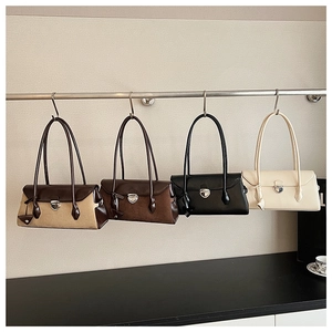 Detailed display of four color options for the stylish Boston shoulder bag with metal clasps