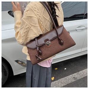 Detail view of the vintage Boston bag showing contrasting suede and smooth leather texture