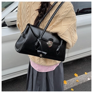 Chic black vintage Boston shoulder bag with silver buckle and autumn street style