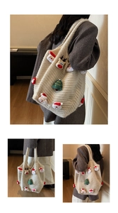 Detail view of large knit tote bag with festive Christmas plush deer and tree ornaments