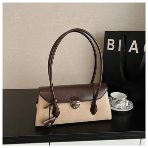 Detail of vintage Boston bag showing beige suede and brown leather contrast textures