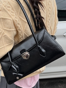 Vintage black leather Boston bag with contrast stitching and silver metal buckle closure