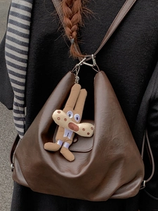 Retro brown soft leather hobo bag for women with a cute cartoon rabbit plush charm