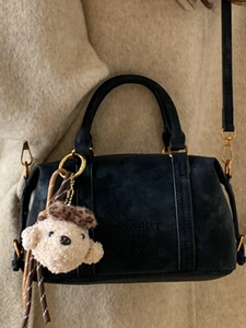 Retro black suede handbag for women with a teddy bear charm and adjustable shoulder strap