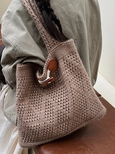 Handmade crochet tote bag with hollow knit pattern and horn button in coffee brown