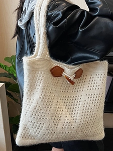 Beige hollow knit tote bag with brown leather accents and horn buckle for women