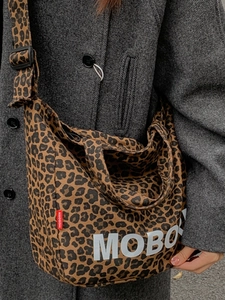 Fashionable leopard print canvas tote bag with large white MOBORN lettering and wide strap