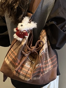 Vintage brown plaid tote bag with wide shoulder strap and cute white plush rabbit charm