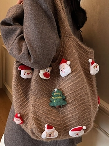 Brown knit tote bag with festive Christmas plush decorations and merry tree embroidery