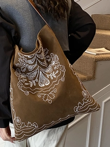 Brown faux suede tote bag with white ethnic embroidery and long shoulder straps