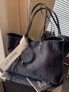 Retro black quilted tote bag with wide 'CLEAR OK' canvas strap and mini pouch
