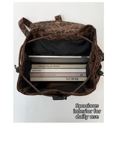 Top view of spacious leopard print backpack interior with drawstring closure and large capacity
