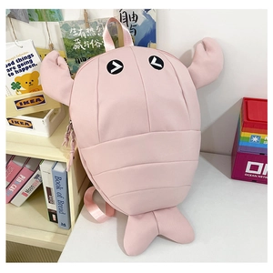Detailed view of pink cartoon lobster backpack with creative 3D claws and soft eyes