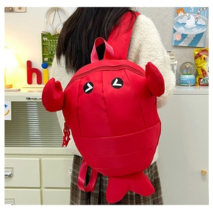 Detailed view of creative red lobster backpack with cute 3D claws and embroidered eyes