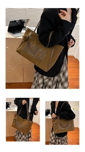 Three-way view of large brown suede tote bag featuring Moacri logo and long shoulder straps