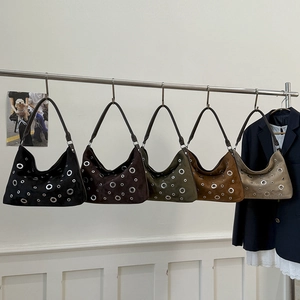Collection of retro suede handbags featuring stylish metal eyelets in five distinct colors