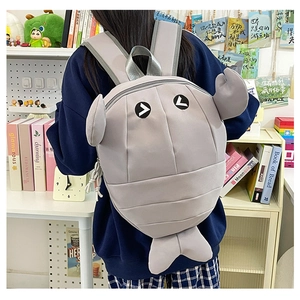 Detail of creative shark shaped grey backpack featuring 3D fins and waterproof nylon fabric