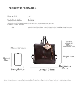 Detail view of brown PU leather backpack with dimensions and plush bear keychain