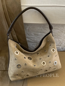 Vintage khaki suede shoulder bag with silver metal eyelets and dark brown leather strap