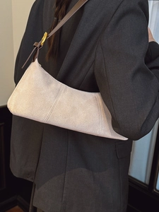 French retro minimalist cream suede shoulder bag with brown leather strap and gold buckle