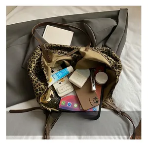 Top view of leopard print tote bag interior showing large capacity for iPad and makeup