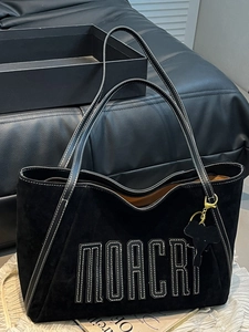 Black suede tote bag with white contrast stitching and MOACRI logo embroidery