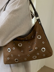 Vintage brown suede shoulder bag with metallic eyelets for women in casual commute style