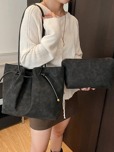 Retro black faux leather tote bag set with knotted shoulder strap and matching clutch