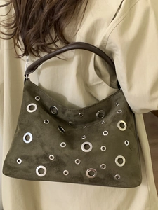 Retro dark green suede tote bag with silver eyelets and brown leather handle