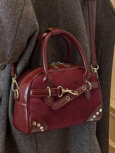 Retro burgundy leather shoulder bag with gold rivets and metallic buckle details