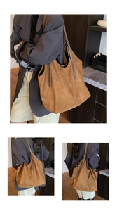 Detailed macro view of the brown faux suede tote bag featuring adjustable shoulder straps