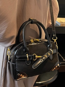 Retro black leather and suede handbag with gold buckle detail and vintage metal hardware