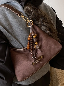 Retro dark brown suede crescent shoulder bag with handcrafted wooden bead tassel charm
