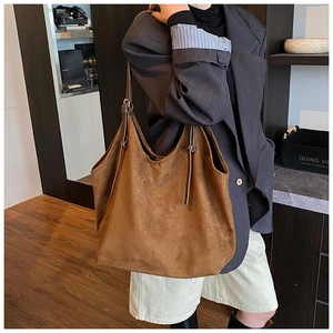 Brown suede tote bag detail showing large capacity and adjustable slim shoulder strap