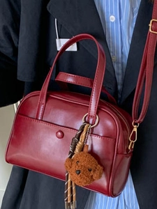 Retro red faux leather pillow handbag for women with a cute brown plush bear charm