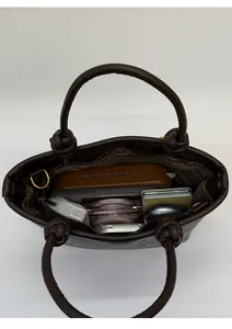 Top view of deep brown leather tote bag interior showing spacious capacity for daily essentials