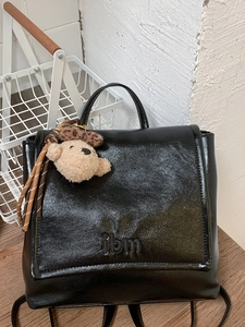 Retro black leather backpack for women with bear pendant and 3D lettering detail