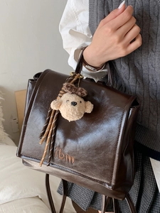 Retro dark brown PU leather backpack with ibm embroidery and cute puppy charm for women