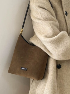 Chic dark brown faux suede underarm bag with NO FILTER patch and sleek black strap