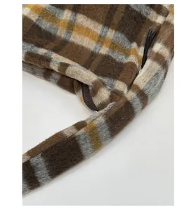 Close-up of durable checkered wool fabric texture and sturdy zipper on tote bag