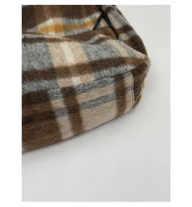 Detail showing side and bottom seams of high-capacity checkered wool tote bag