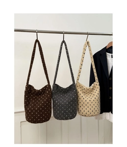 Three plush floral tote bags in brown grey and beige hanging for commute style