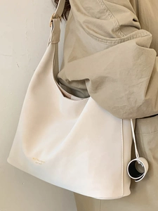 Minimalist creamy white large capacity faux leather tote bag with wide adjustable strap