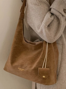 Vintage brown large capacity tote bag with adjustable strap and small coin purse charm