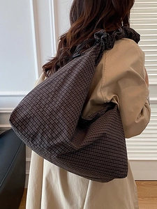 Brown checkered oversized tote bag with drawstring detail and slouchy design